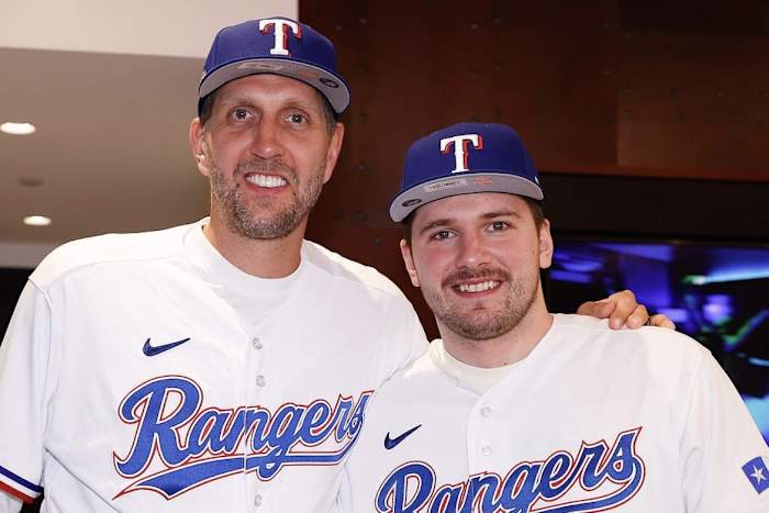 Dirk Nowitzki and Luka Doncic take in a Texas Rangers postseason game together.